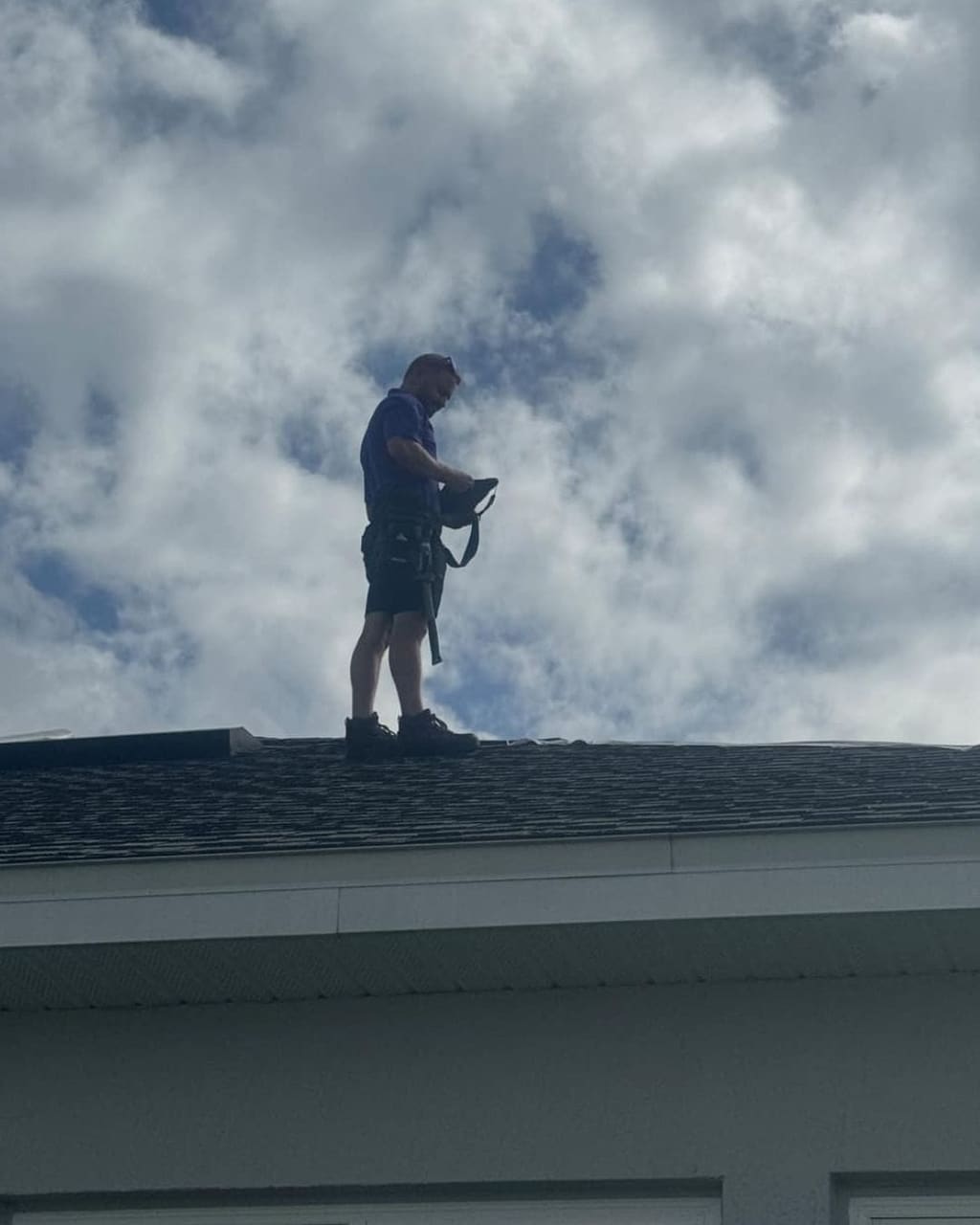 Gravity Roofing professional performing a roof inspection in Central Florida