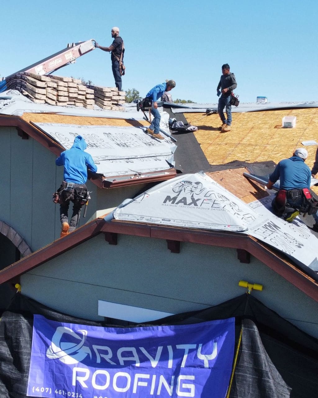 Gravity Roofing crew working on a Central Florida roof
