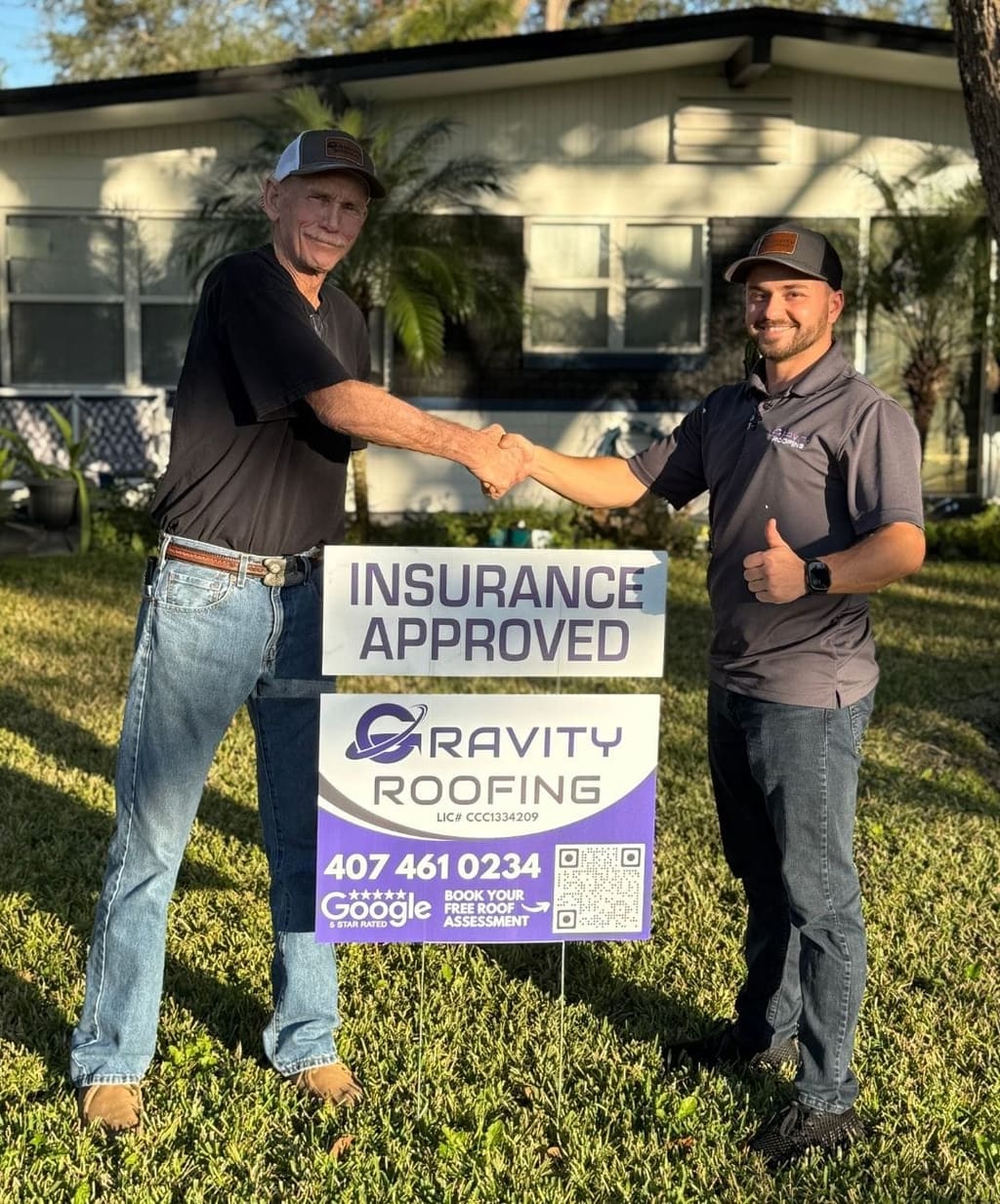 Gravity Roofing representative with a homeowner after insurance approval for a roofing project in Central Florida. Gravity Roofing - Best Roofer in Orlando